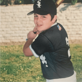 Kid playing baseball.